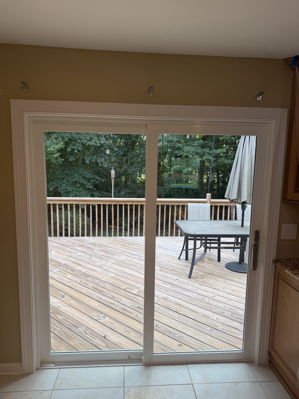 White sliding patio door to deck